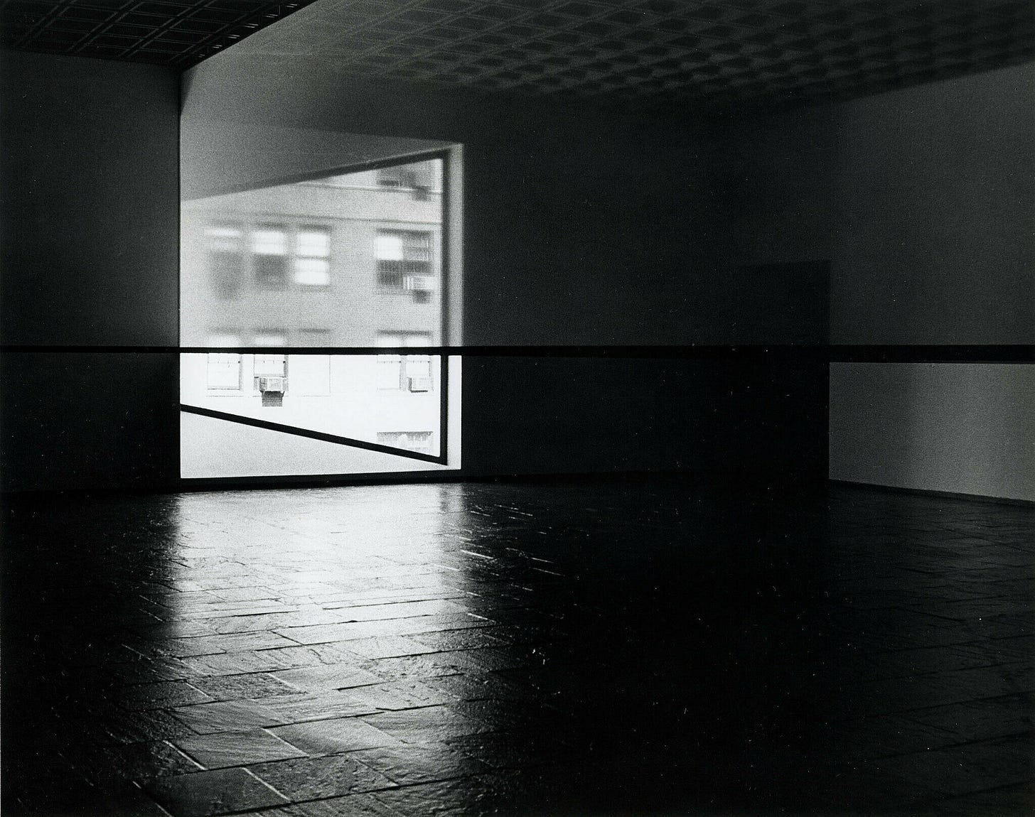 A translucent scrim runs across the gallery in a 1977 installation by Robert Irwin.