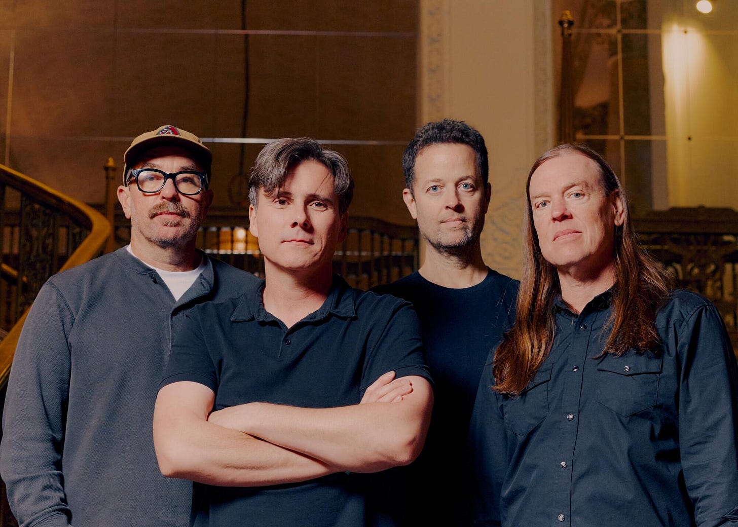From left to right, Zach Lind, Jim Adkins, Tom Linton and Rick Burch of Jimmy Eat World stand in front of stairs