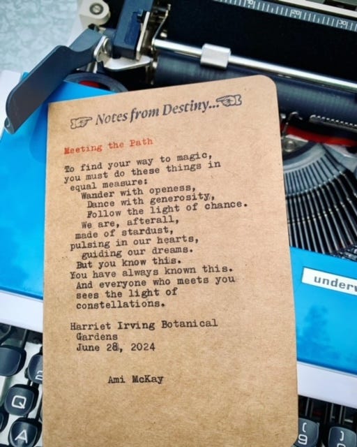 A dark-haired woman sits with a typewriter in a botanical garden, a freshly typed poem sits on a blue vintage trypewriter, a typewriter sits on a table on a rocky beach, a pink lotus flower blossoms in a lily pond