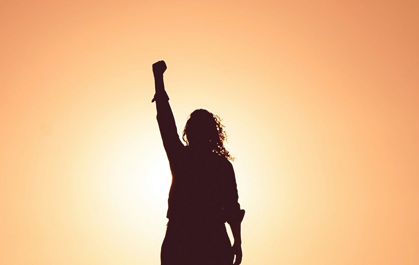 woman with hand raised, michelle cowles