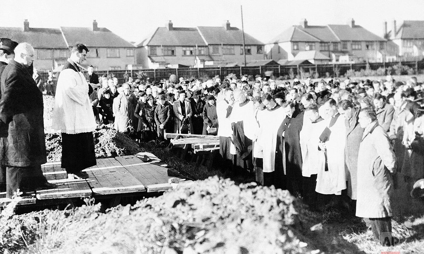 A solemn mass burial service is held in Coventry, England, on December 9, 1940, honoring those who perished in the catastrophic German air raid on November 14. A solemn mass burial service is held in Coventry, England, on December 9, 1940, honoring those who perished in the catastrophic German air raid on November 14.