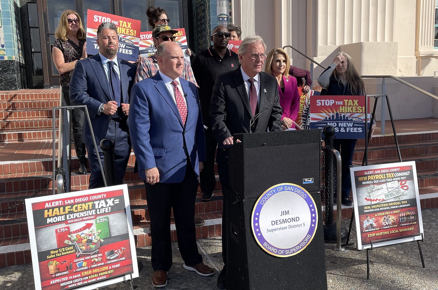 San Diego County Supervisor Jim Desmond, middle, is flanked by Vista Mayor John Franklin, left, San Marcos Mayor Rebecca Jones, right and others during a press conference on Tuesday protesting several tax increase proposals by Terra Lawson-Remer, labor unions and nonprofits. Steve Puterski photo San Diego County Supervisor Jim Desmond, middle, is flanked by Vista Mayor John Franklin, left, San Marcos Mayor Rebecca Jones, right and others during a press conference on Tuesday protesting several tax increase proposals by Terra Lawson-Remer, labor unions and nonprofits. Steve Puterski photo