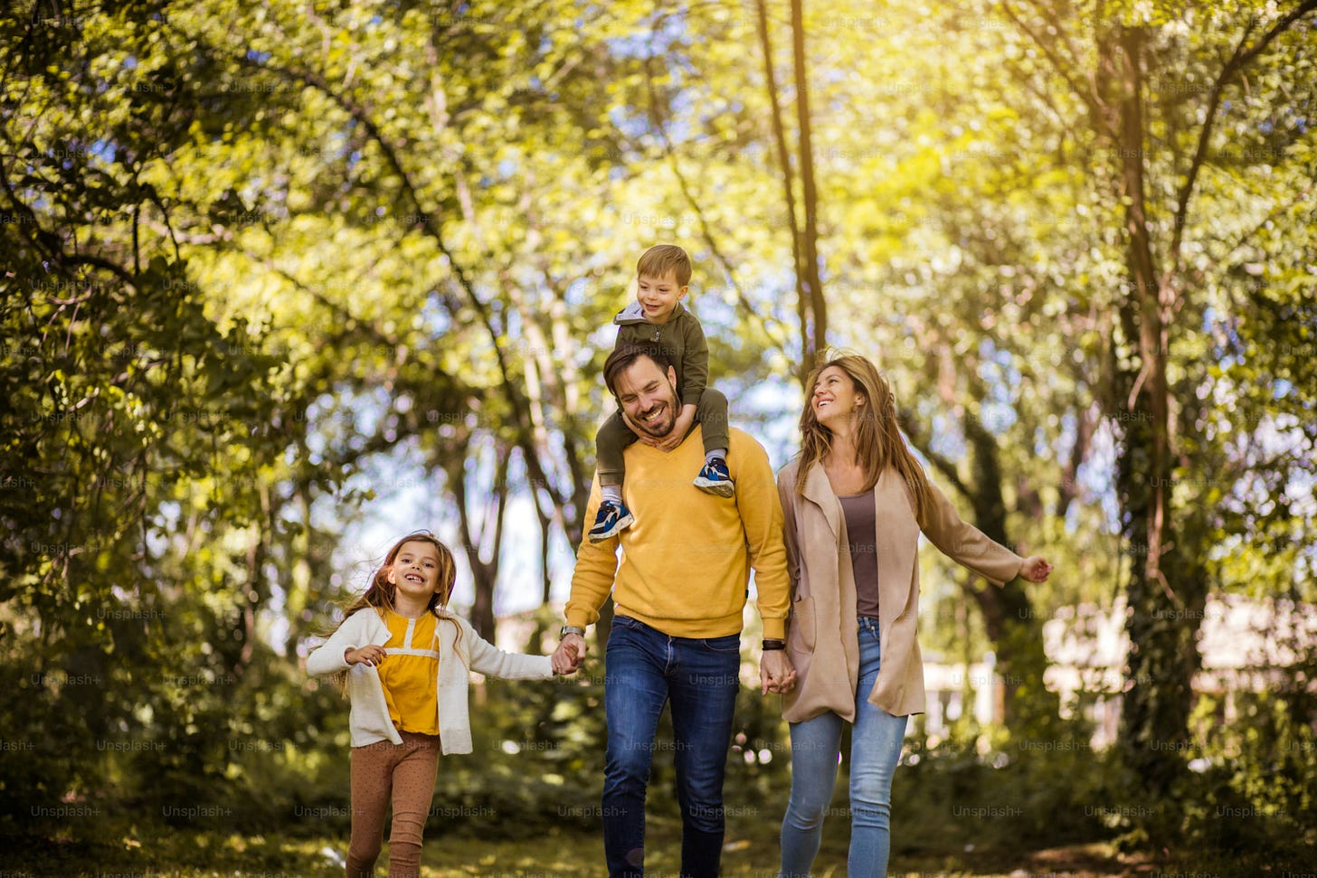 Family fun all summer long. Parents spending time with their children outside. Family fun all summer long. Parents spending time with their children outside.