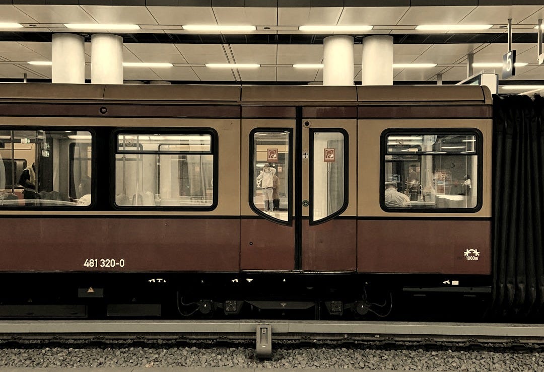 white and red train in train station white and red train in train station