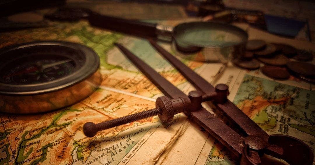 brown wooden handle on white and brown textile