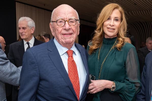 Mr. Murdoch, left, with Ann Lesley Smith.