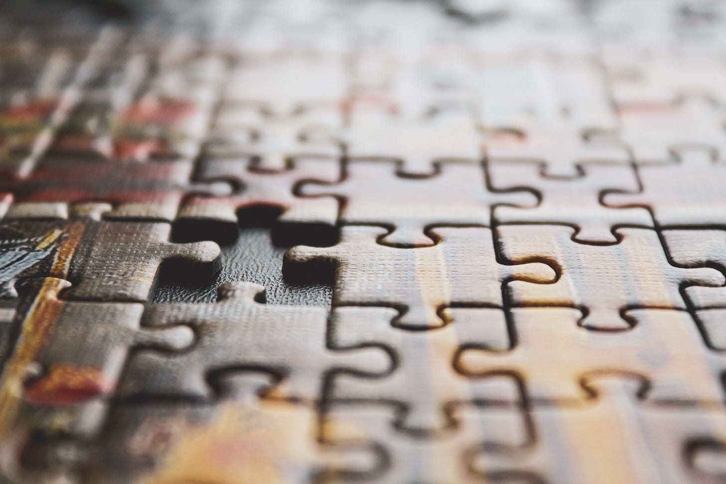 A jigsaw puzzle with one piece missing