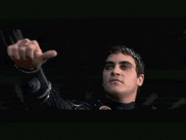 Movie gif. Joaquin Phoenix as Commodus in The Gladiator with his arm out doing a sideways thumbs up. Surveying the scene for a moment, his expression becomes icy as he quickly points his thumb down. Movie gif. Joaquin Phoenix as Commodus in The Gladiator with his arm out doing a sideways thumbs up. Surveying the scene for a moment, his expression becomes icy as he quickly points his thumb down.