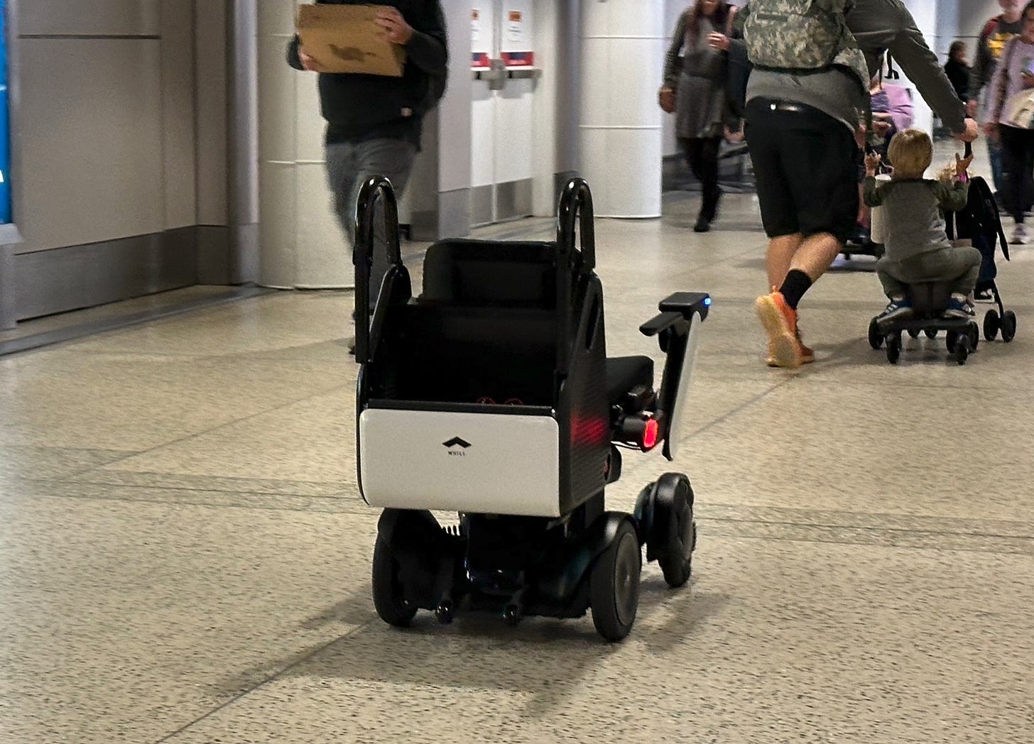 Self-driving wheelchairs at Sea-Tac Airport whisk mobility challenged travelers to their gates – GeekWire Self-driving wheelchairs at Sea-Tac Airport whisk mobility challenged travelers to their gates – GeekWire