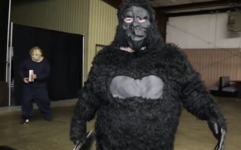 [Screenshot: Guy in gorilla costume, followed by a guy cosplaying as sadness]