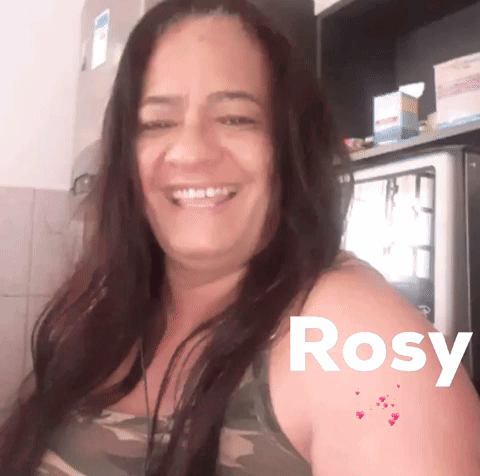 a woman is smiling with the name rosy written on her arm