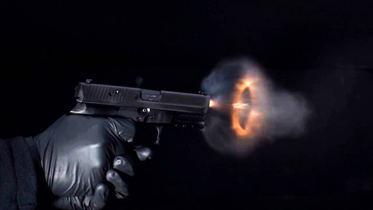 Super slow-motion video of bullets leaving a handgun Super slow-motion video of bullets leaving a handgun