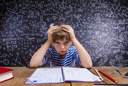 A child overwhelmed with math A child overwhelmed with math