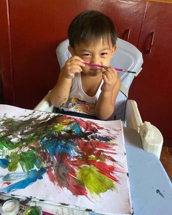 Our little boy Rafa doing his favorite painting activity
