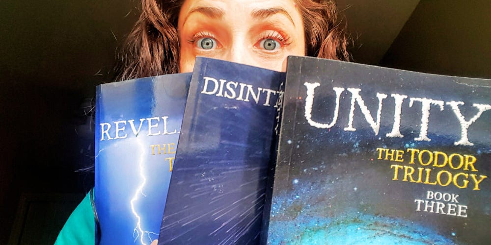 My eyes peeking over the tops of the three books of The Todor Trilogy, a fantasy series I wrote a few years back. My eyes peeking over the tops of the three books of The Todor Trilogy, a fantasy series I wrote a few years back.