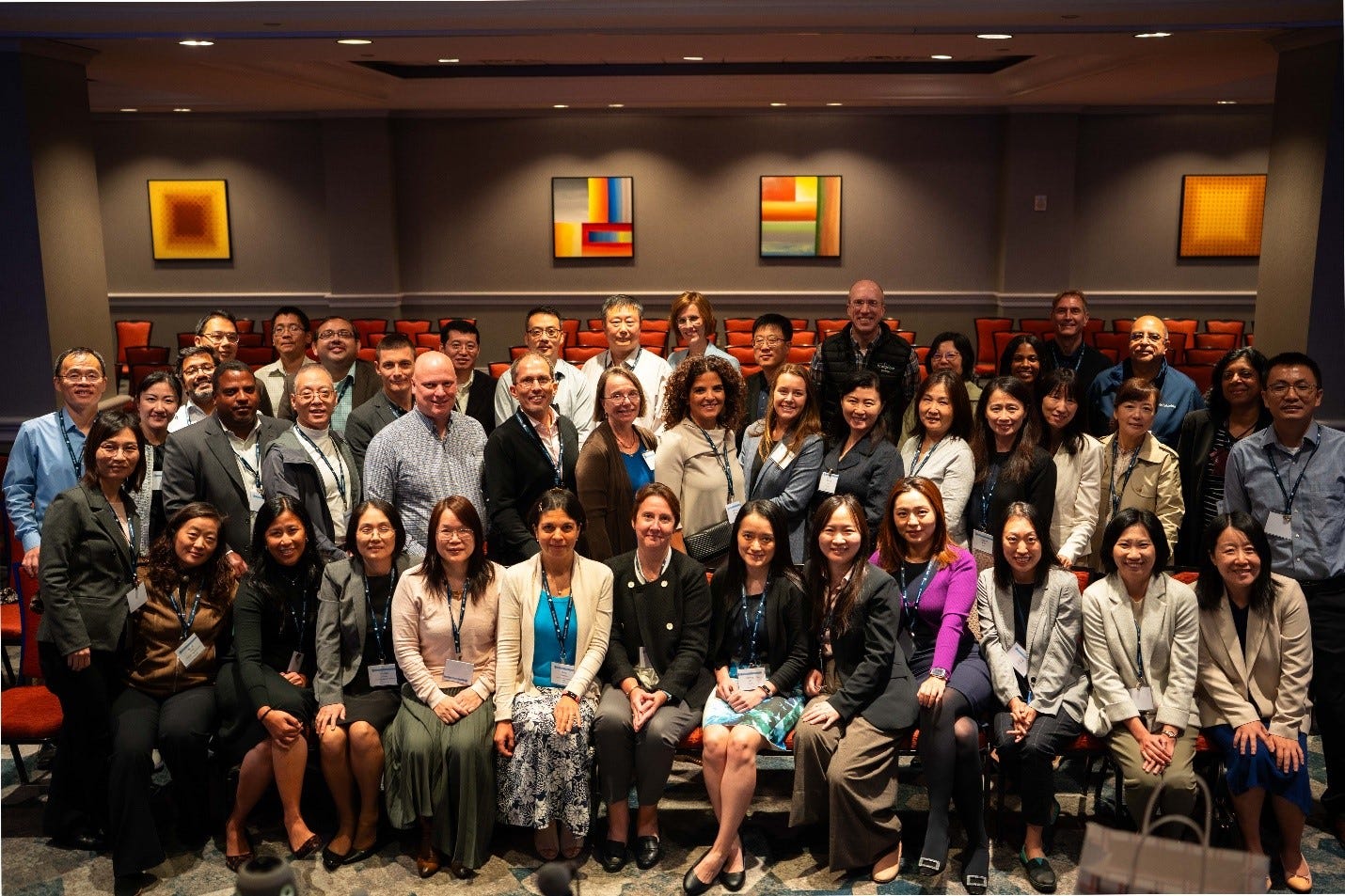 A group of people posing for a photo

Description automatically generated