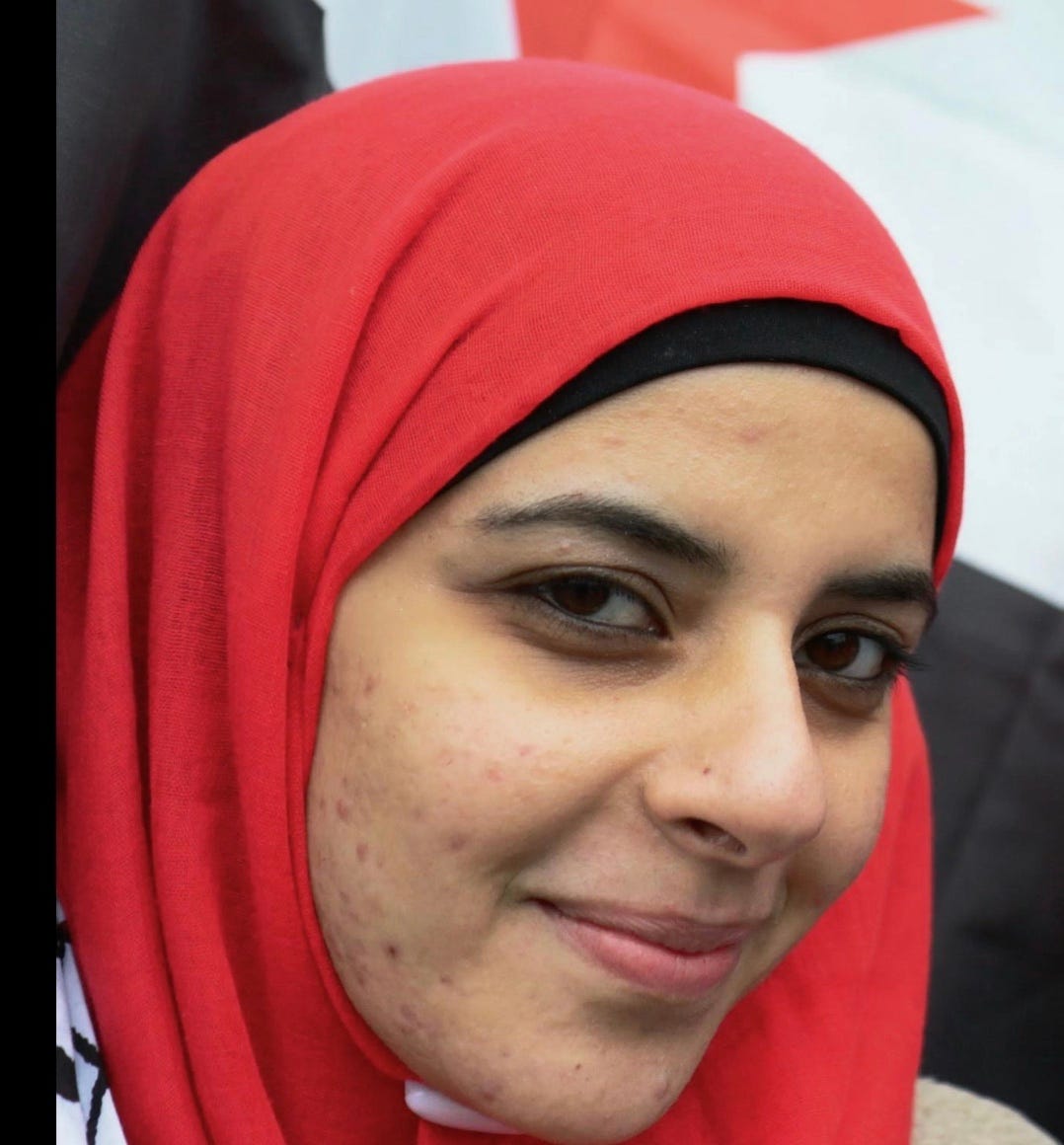A person wearing a red head scarf

AI-generated content may be incorrect.