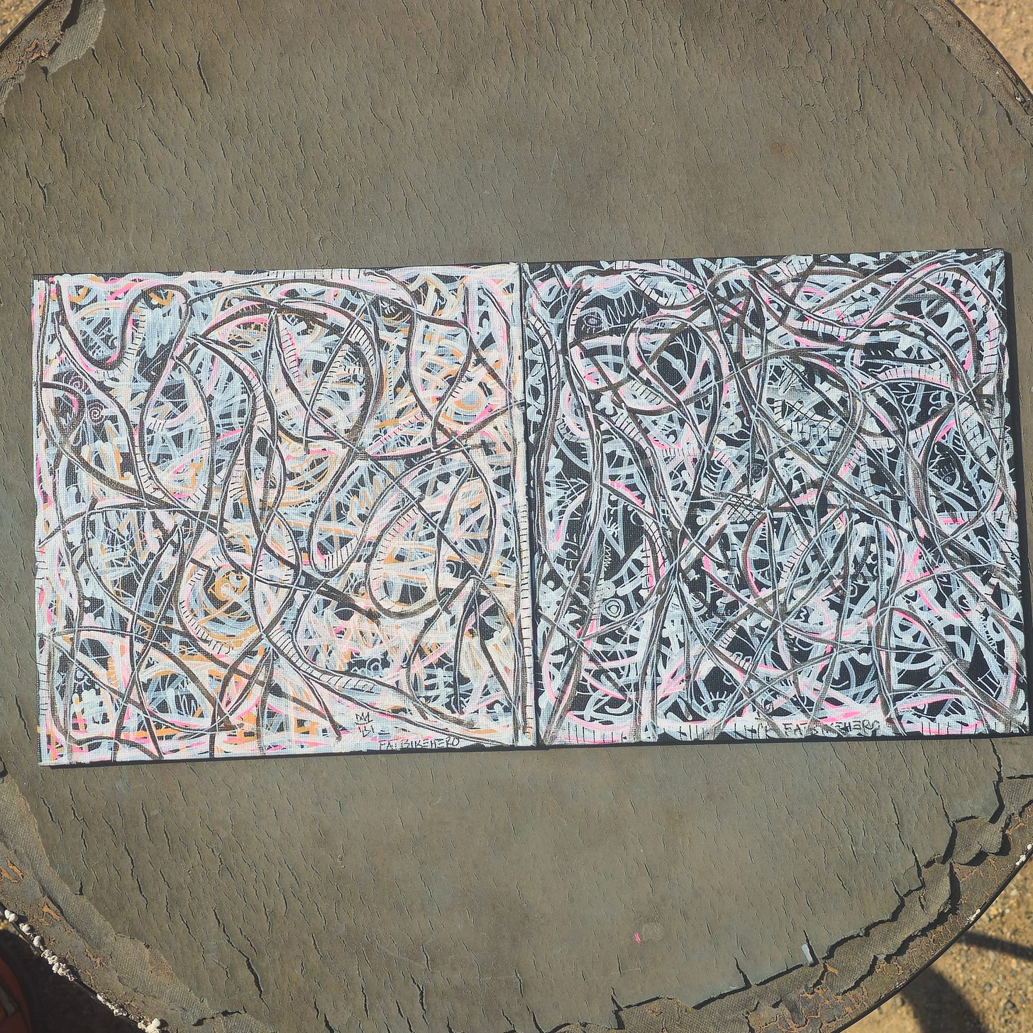A two-panel abstract painting by FatbikeHero featuring a dense, interlocking web of white, pink, and black lines on a textured canvas.
