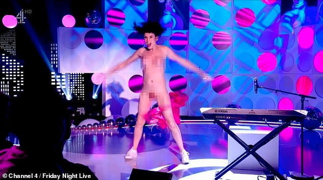 Gray jumps up from the piano before counting down 'one, two, three' and ripping off her suit and exposing herself entirely