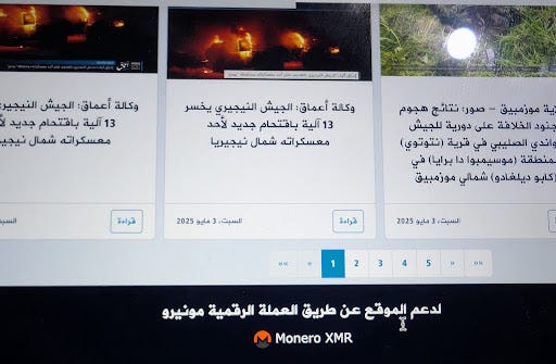 Arabic news website showing articles about military events with images of explosions and text about Monero cryptocurrency support.