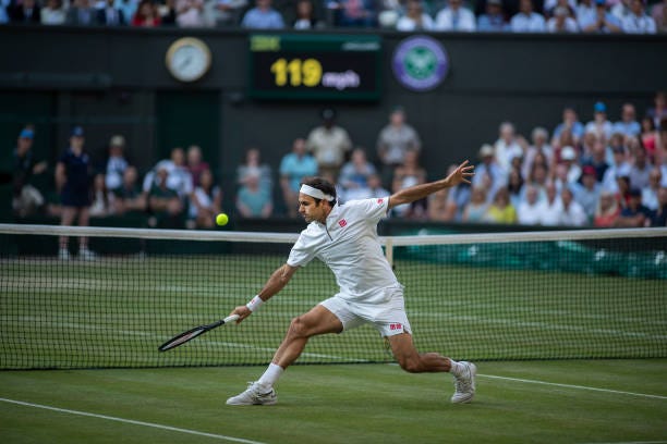 July 12: A general view of Roger Federer of Switzerland playing a volley at the net during his match against Rafael Nadal of Spain during the Men's... July 12: A general view of Roger Federer of Switzerland playing a volley at the net during his match against Rafael Nadal of Spain during the Men's...