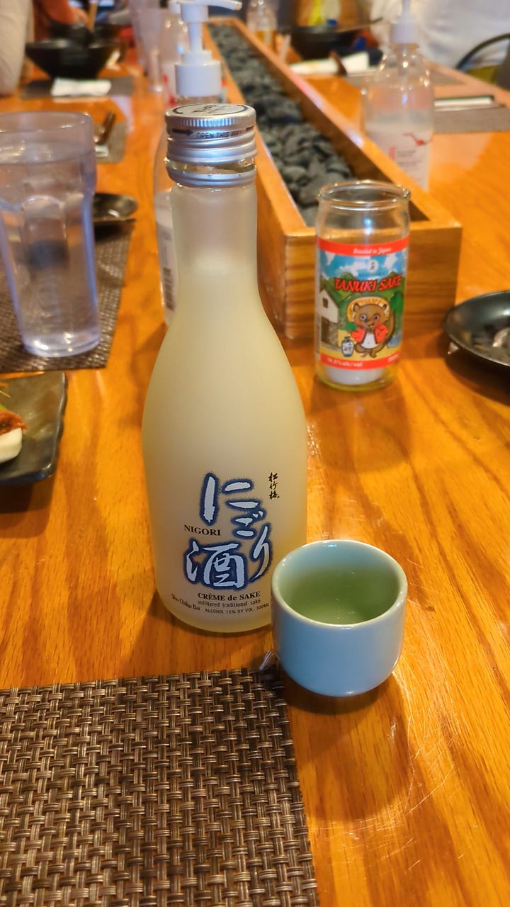 Tonkotsu red ramen bowl and cold sake from Sakuramen
