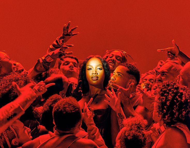 This may contain: a group of people standing next to each other in front of a red wall with a woman's face painted on it