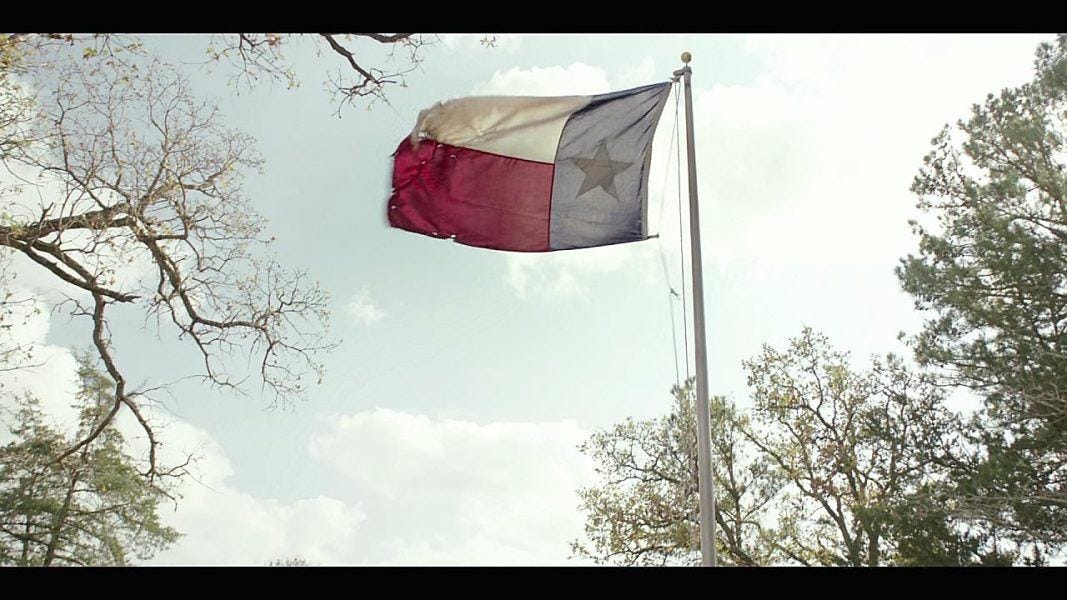 Walker Texas flag flying tattered in sky. Walker Texas flag flying tattered in sky.