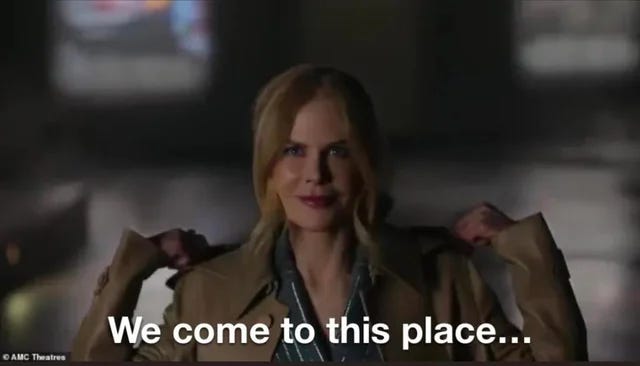 Nicole Kidman removes her hood in the famous AMC ad. The caption reads, "We come to this place..."