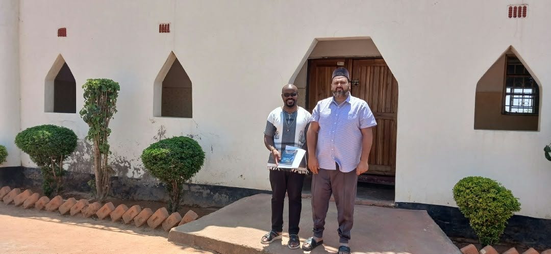 Fr. Remmy Banda and Imam Faiz Yaqoob at the entrance of the Ahmadiyya Mosque, Pemba Fr. Remmy Banda and Imam Faiz Yaqoob at the entrance of the Ahmadiyya Mosque, Pemba