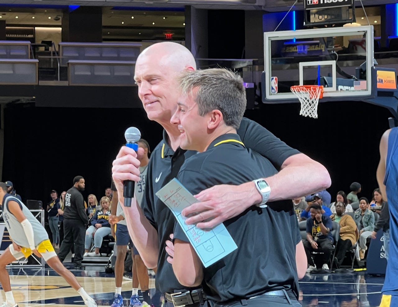 Rick Carlisle hugs Zach Eagle at Pacers FanJam. Rick Carlisle hugs Zach Eagle at Pacers FanJam.