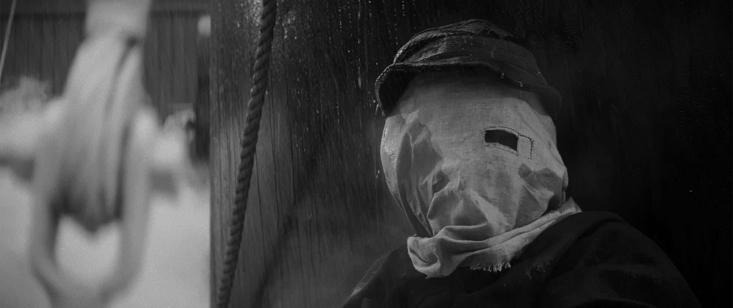 The Elephant Man | Still features John Hurt as John Merrick under a hood.
