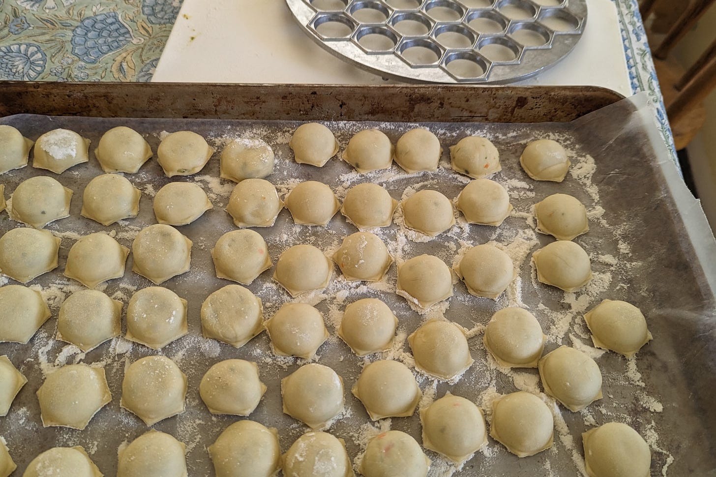 Sheet pan with freshly made dumplings