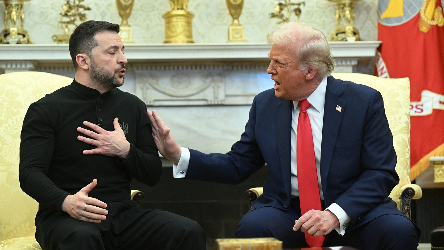 Two men seated and conversing in a formal room with golden decorations. One man, in a black outfit with a beard, gestures with his hand on his chest. The other, wearing a blue suit and red tie, reaches out with his hand. Two men seated and conversing in a formal room with golden decorations. One man, in a black outfit with a beard, gestures with his hand on his chest. The other, wearing a blue suit and red tie, reaches out with his hand.
