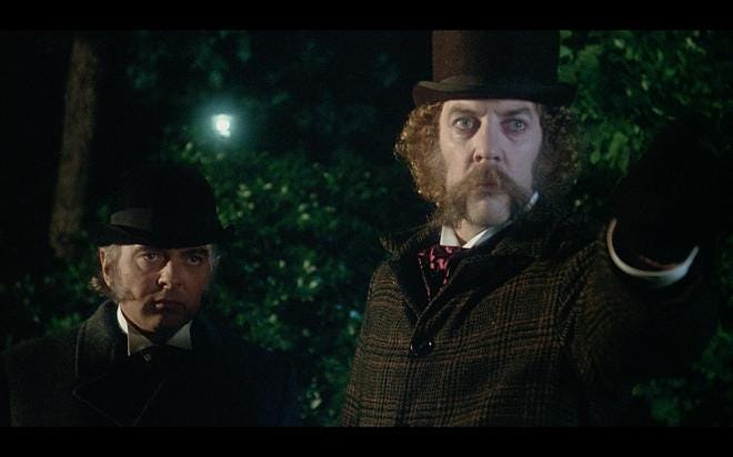 Donald Sutherland in a top hat with enormous side whiskers and a long mosutache. Donald Sutherland in a top hat with enormous side whiskers and a long mosutache.