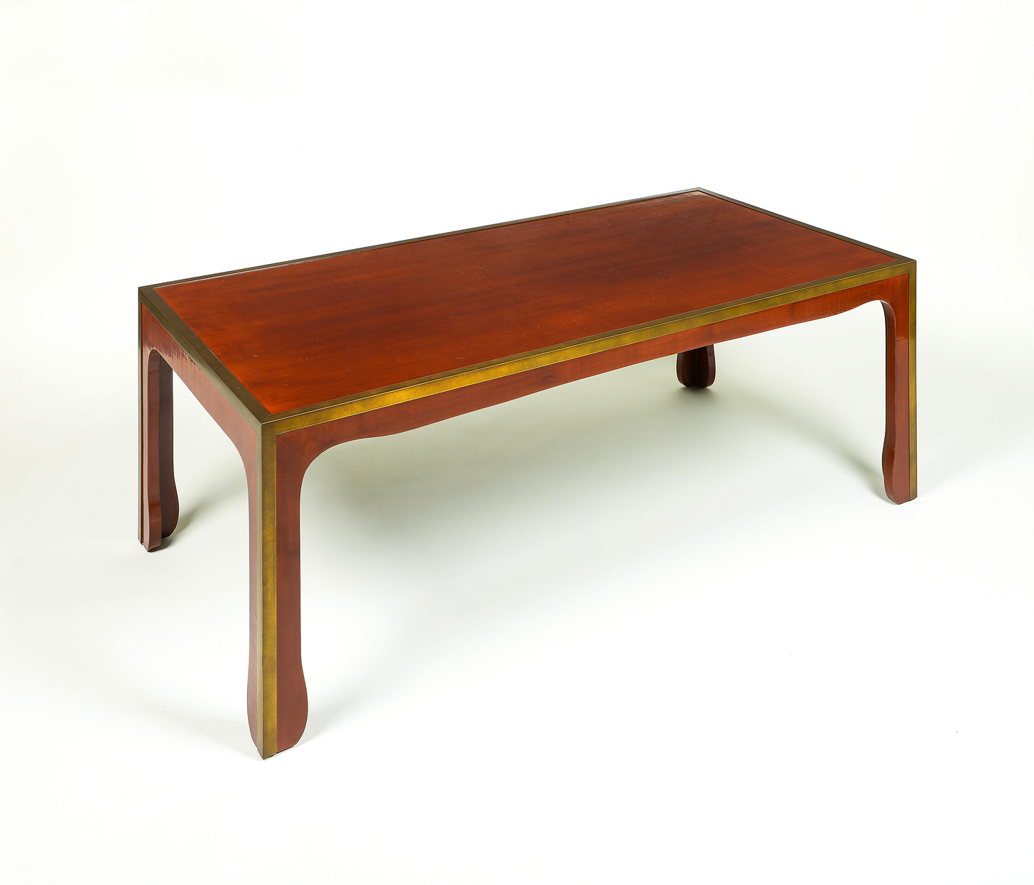 The rectangular top with attractive craquelure, raised on shaped legs; with brass trimming to edges.