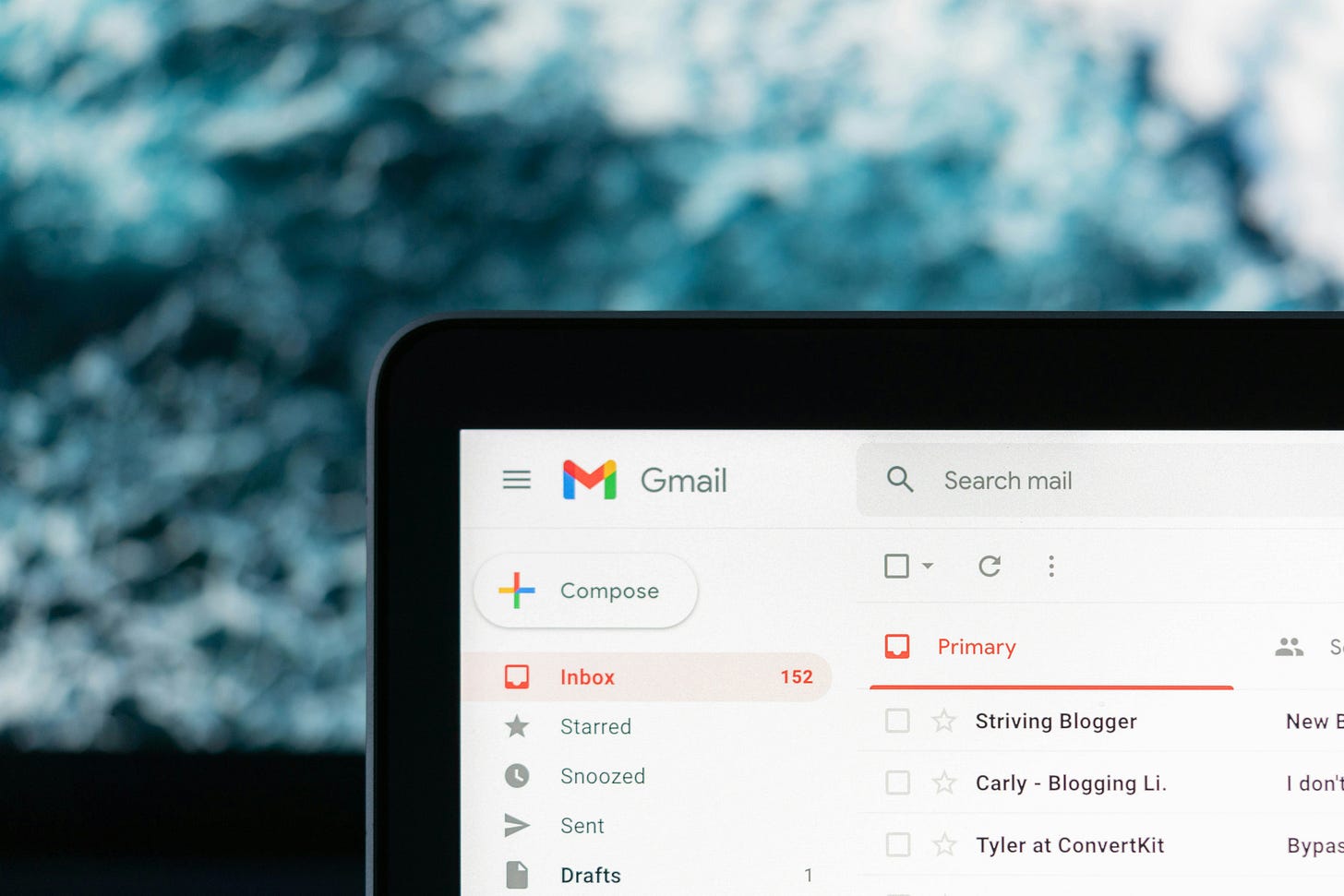 photo of the corner of a laptop screen open to a gmail inbox photo of the corner of a laptop screen open to a gmail inbox