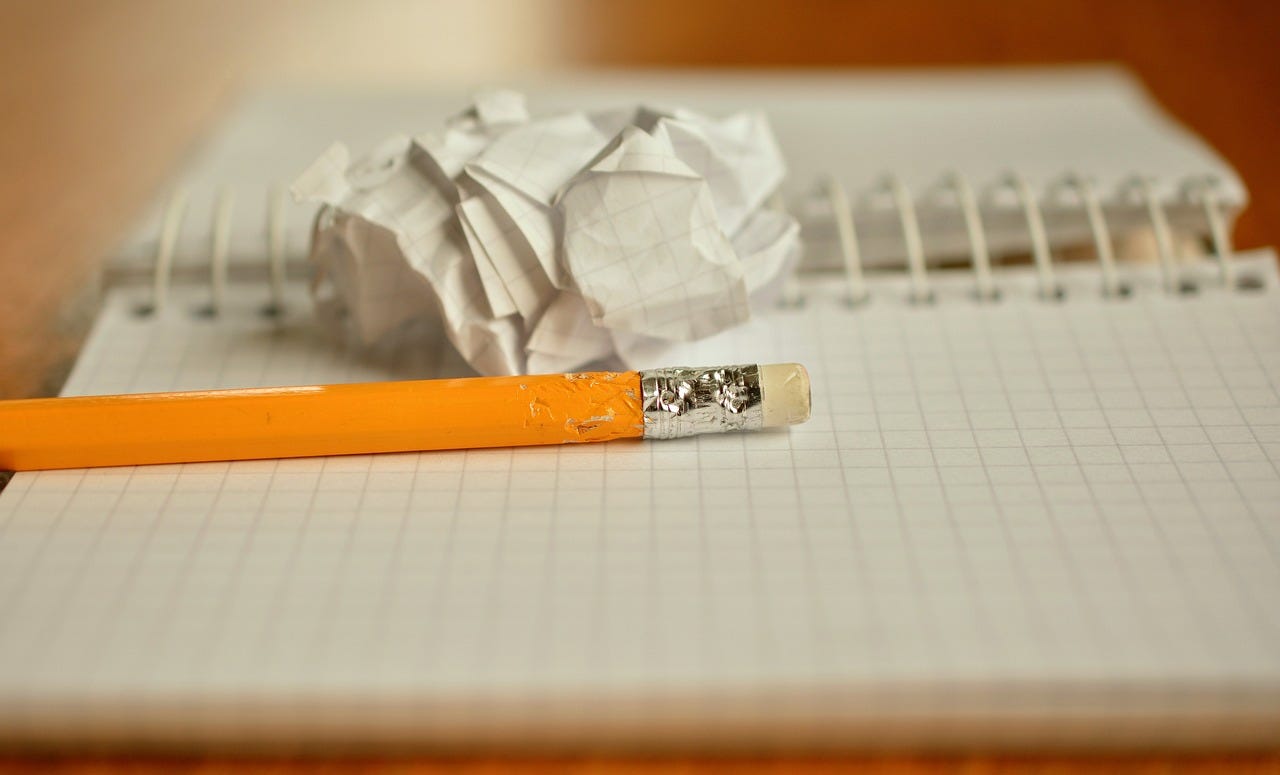 a pencil sitting on an open journal