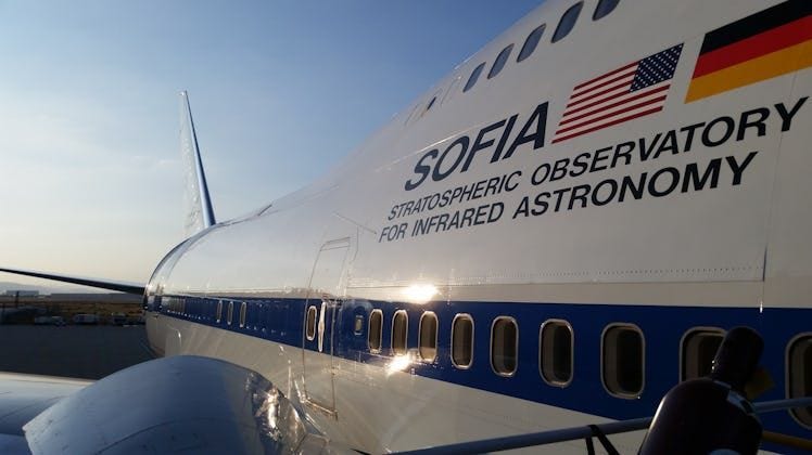 Color photo of the side of an airplane, which is labelled "Stratospheric Observatory for Infrared As...