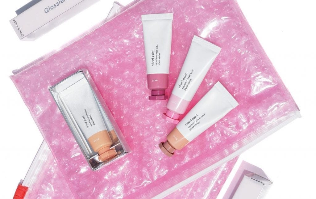 As Glossier's Pink Pouch Proceeds in the Trademark Registration Process,  Lookalike Packaging Emerges - The Fashion Law