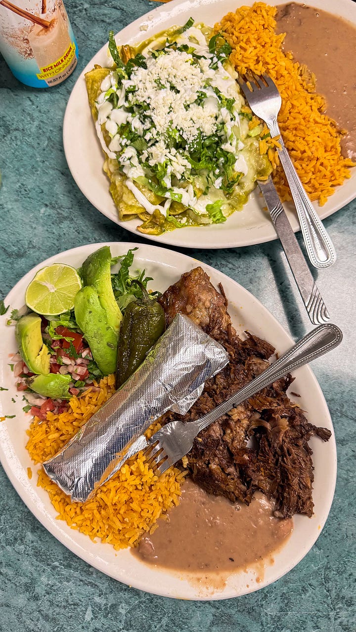 A closeup of the passion-fruit filled tres leches and barbacoa surrounded by rice and peppers.