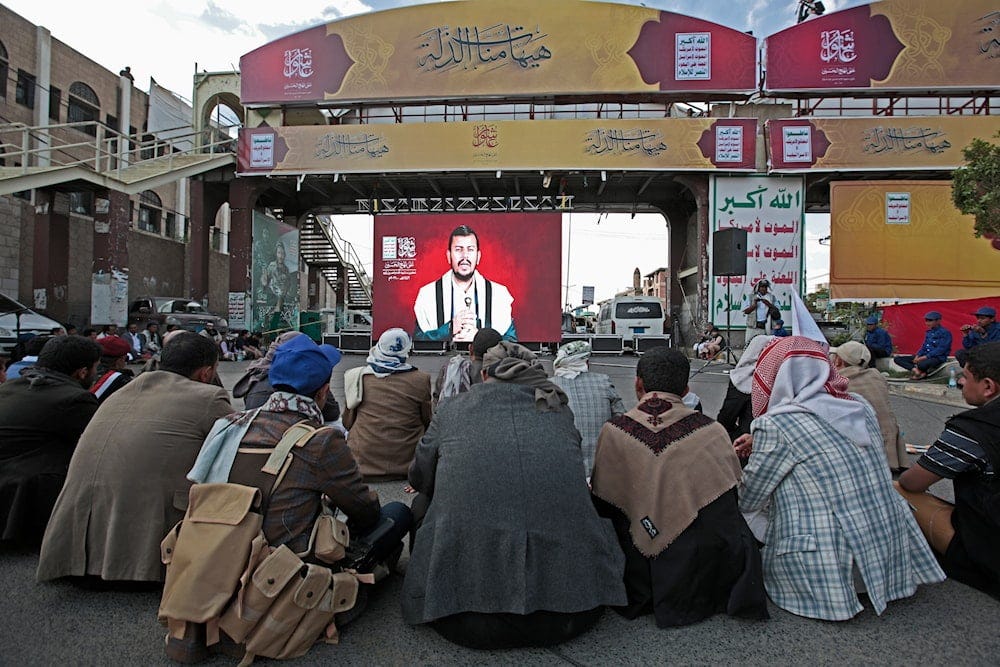 Supporters of Sayyed Abdul-Malik al-Houthi, leader of Yemen’s Ansar Allah movement, watch his speech shown on a screen in Sanaa, Yemen, Thursday, Aug. 19, 2021. (AP) Supporters of Sayyed Abdul-Malik al-Houthi, leader of Yemen’s Ansar Allah movement, watch his speech shown on a screen in Sanaa, Yemen, Thursday, Aug. 19, 2021. (AP)