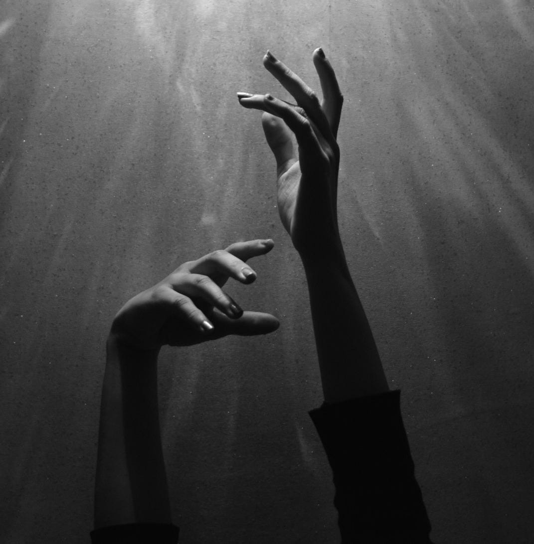 person raising both hands