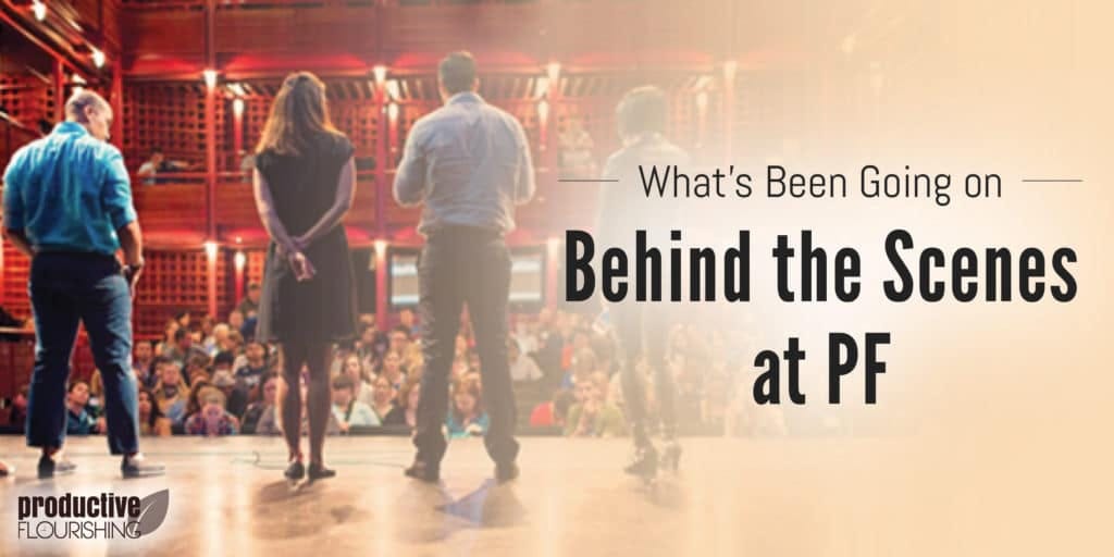 Image of a group of people on a stage, facing the crowd. Text Overlay: What's Been Going on Behind the Scenes at PF Image of a group of people on a stage, facing the crowd. Text Overlay: What's Been Going on Behind the Scenes at PF