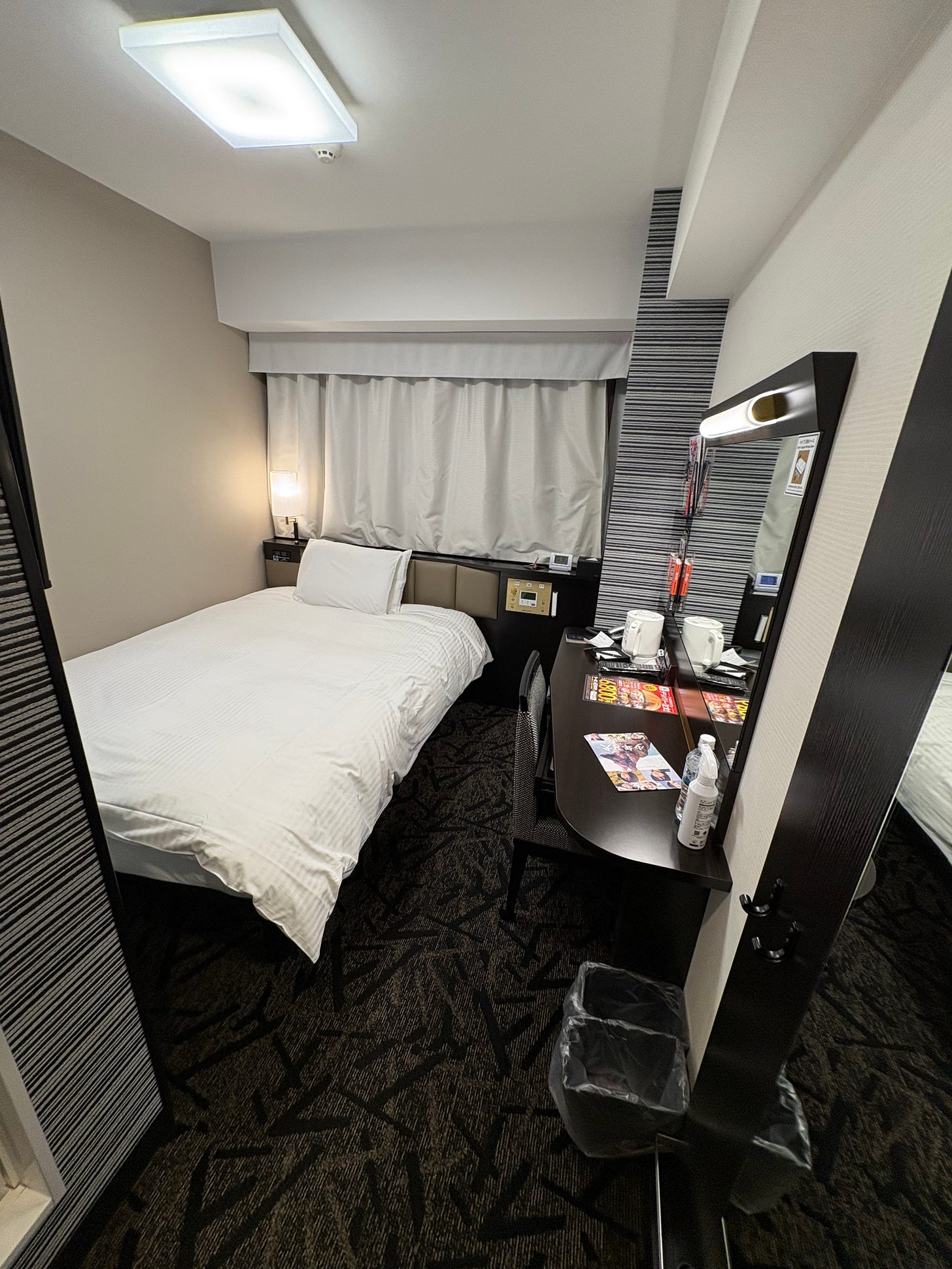 Small bedroom at APA hotel in Osaka, Japan, near Osaka Castle.