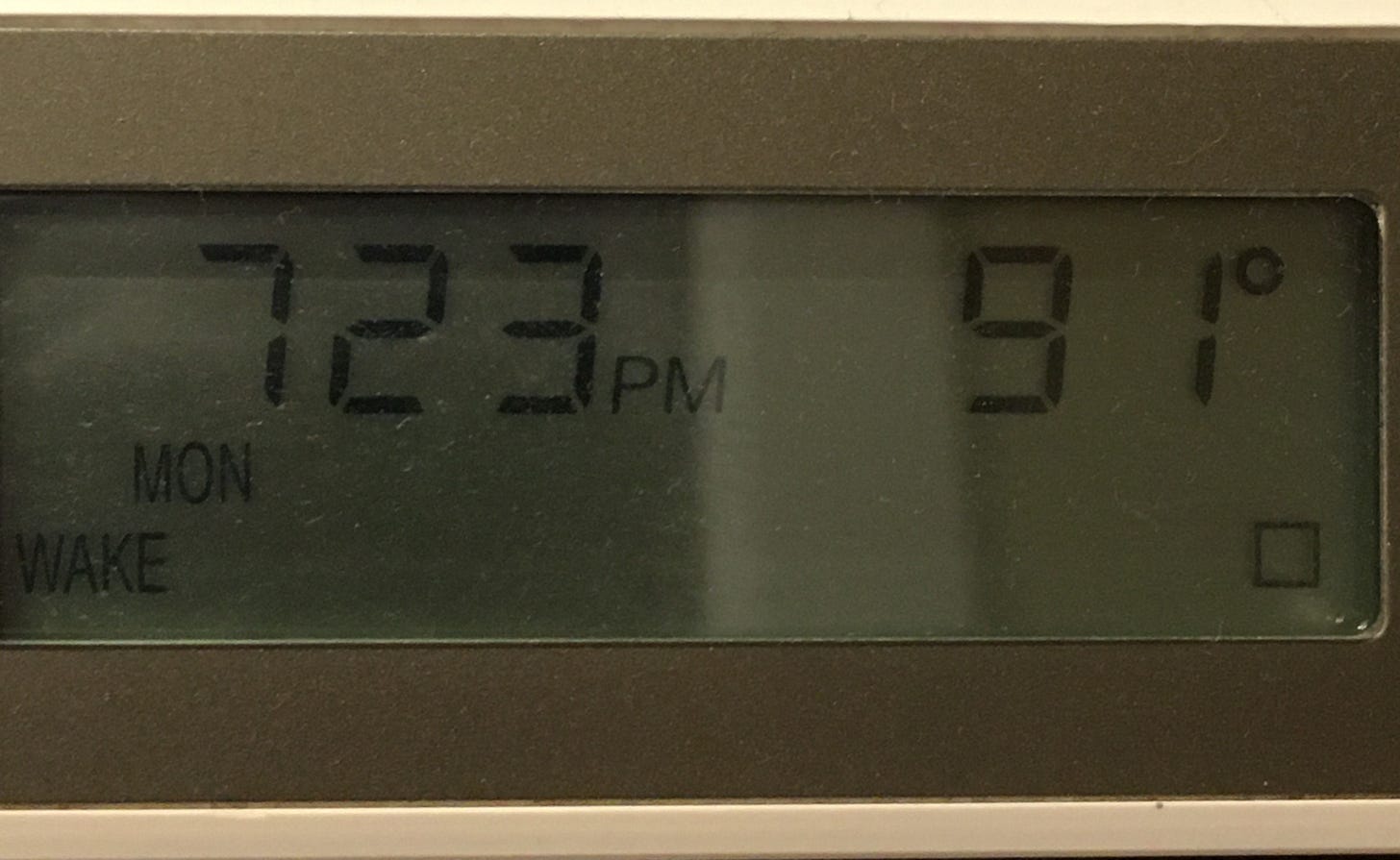 thermostat reading 7:23 pm and 91 degrees