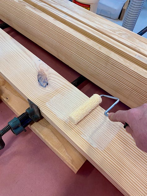 Gluing up the top: Ordering boards, rolling on glue, clamping, a gap opens, trying to close the gap, creating space for a planing stop, more gluing up, popping out the placeholder.