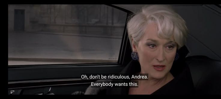 This may contain: an older woman sitting in a car with a quote on the front seat and behind her