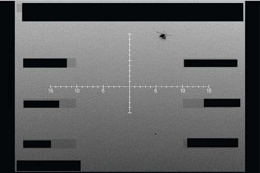 A monochrome military radar display showing a tactical interface with an unidentified aerial object being tracked in restricted airspace.