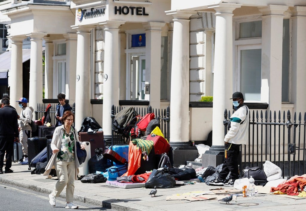 Asylum seekers protesting outside a London hotel.